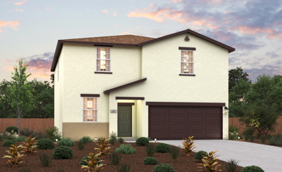 A house with a garage and bushes in front of it.