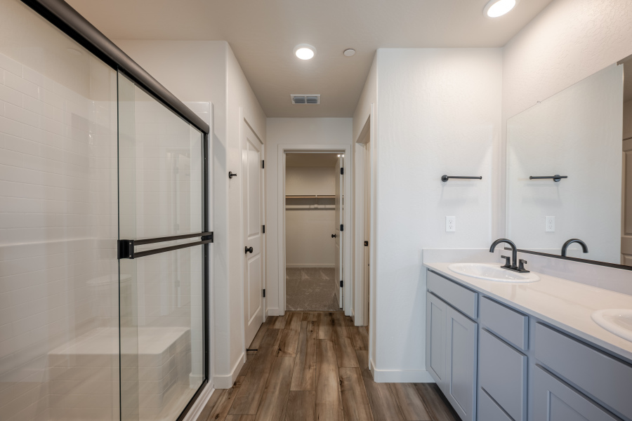 A bathroom with a glass shower.