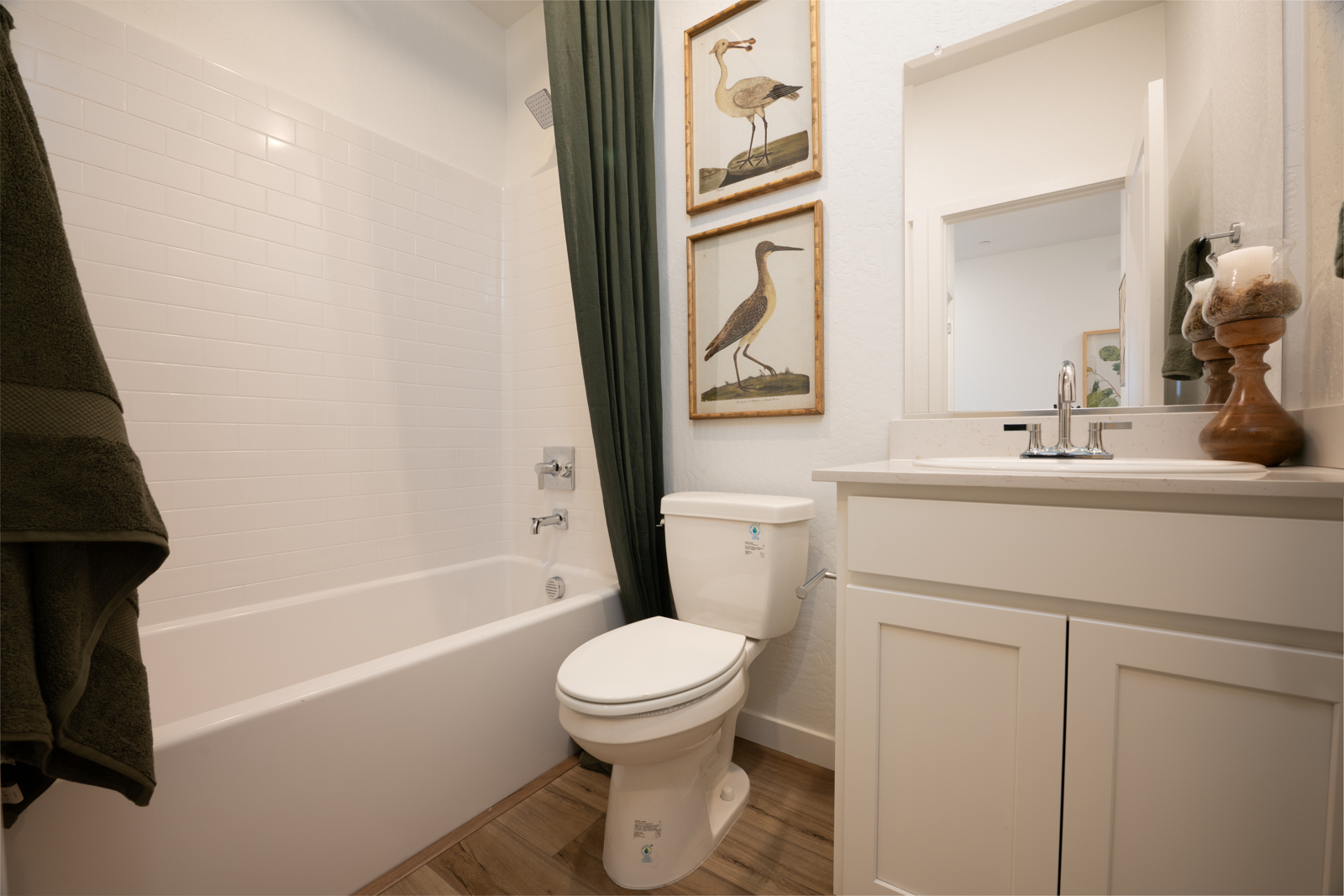 A bathroom with a toilet and bathtub.