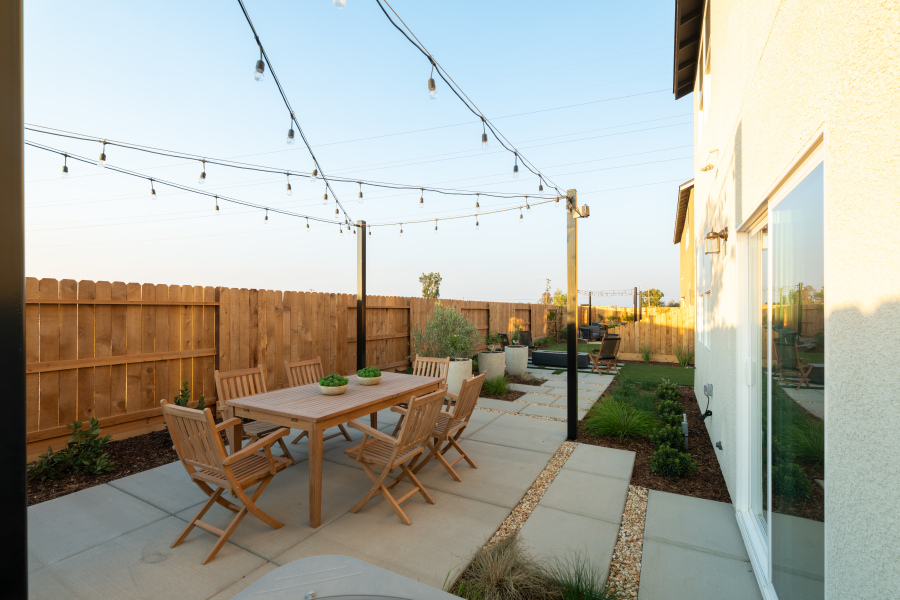 A table and chairs on a patio.