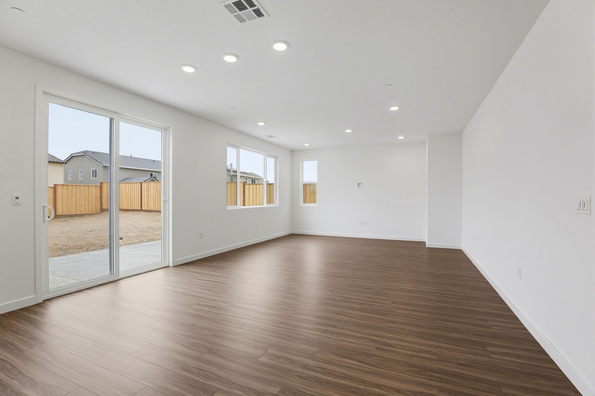 A room with a wood floor and a wood floor.