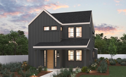 A house with a fence and trees in the back.