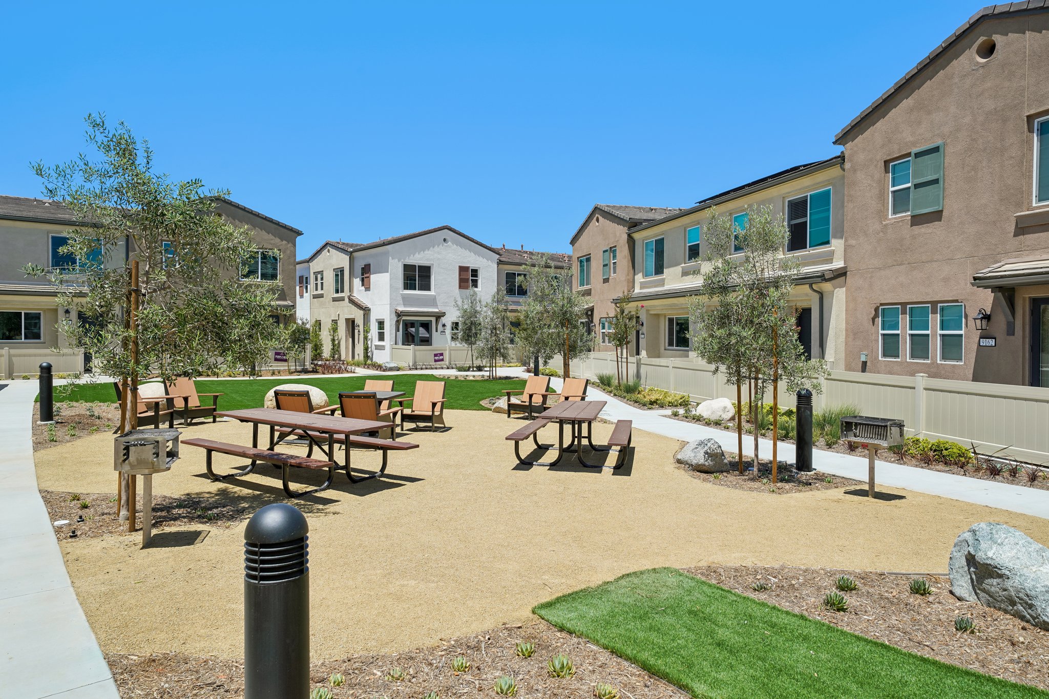 A courtyard with tables and chairs.