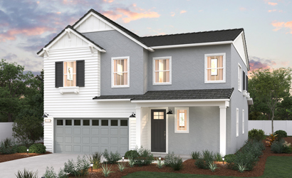 A white house with a garage.