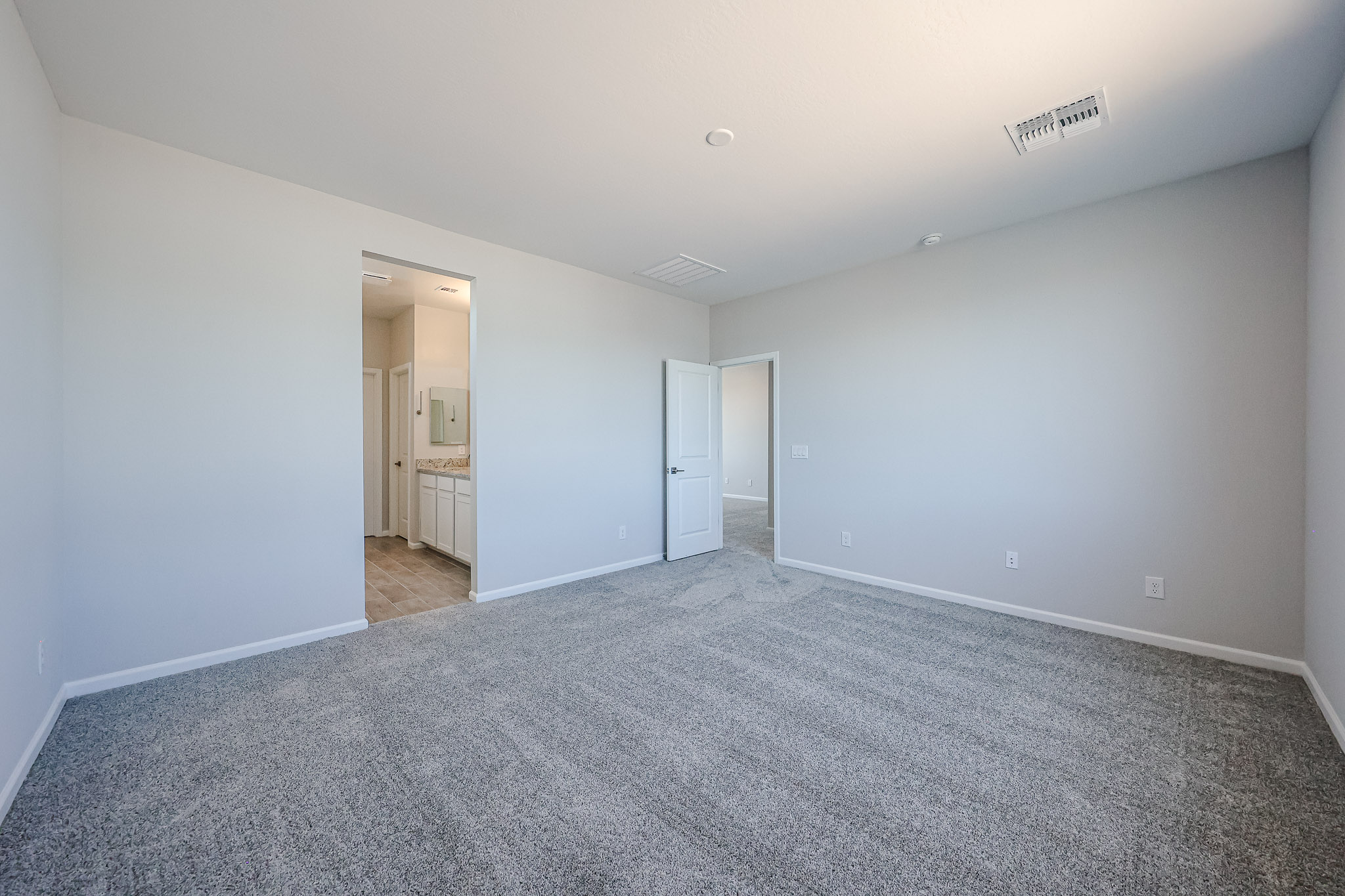 A long hallway with white walls.