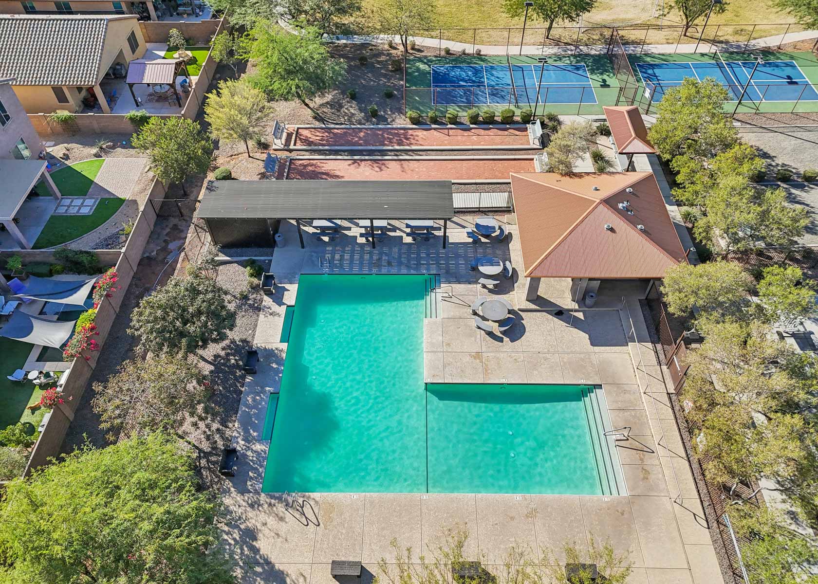 A pool surrounded by trees.
