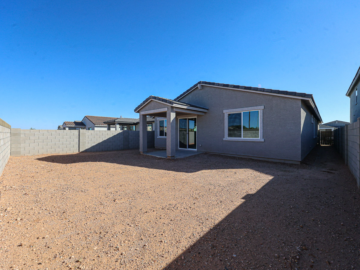 A house with a dirt yard.