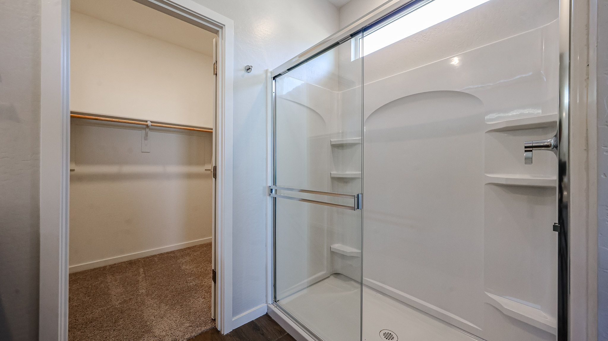 A shower with glass doors.