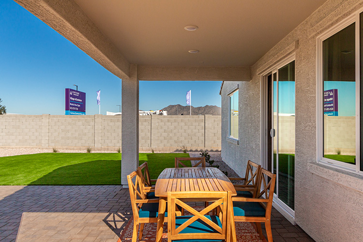 A patio with a table and chairs.