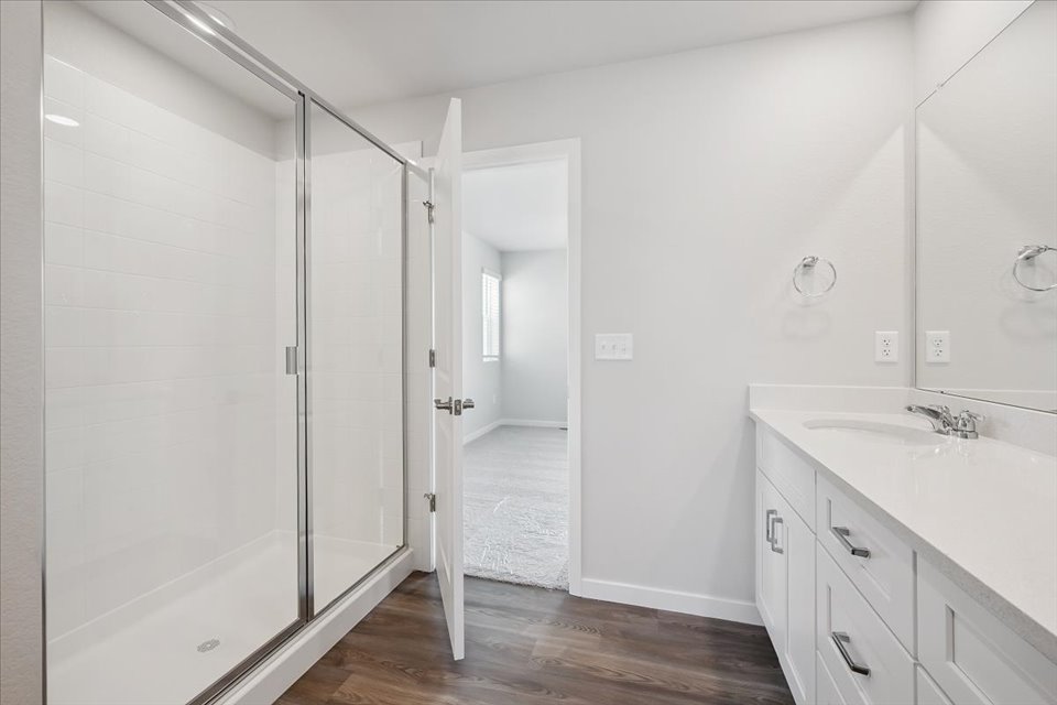 A bathroom with a glass shower.