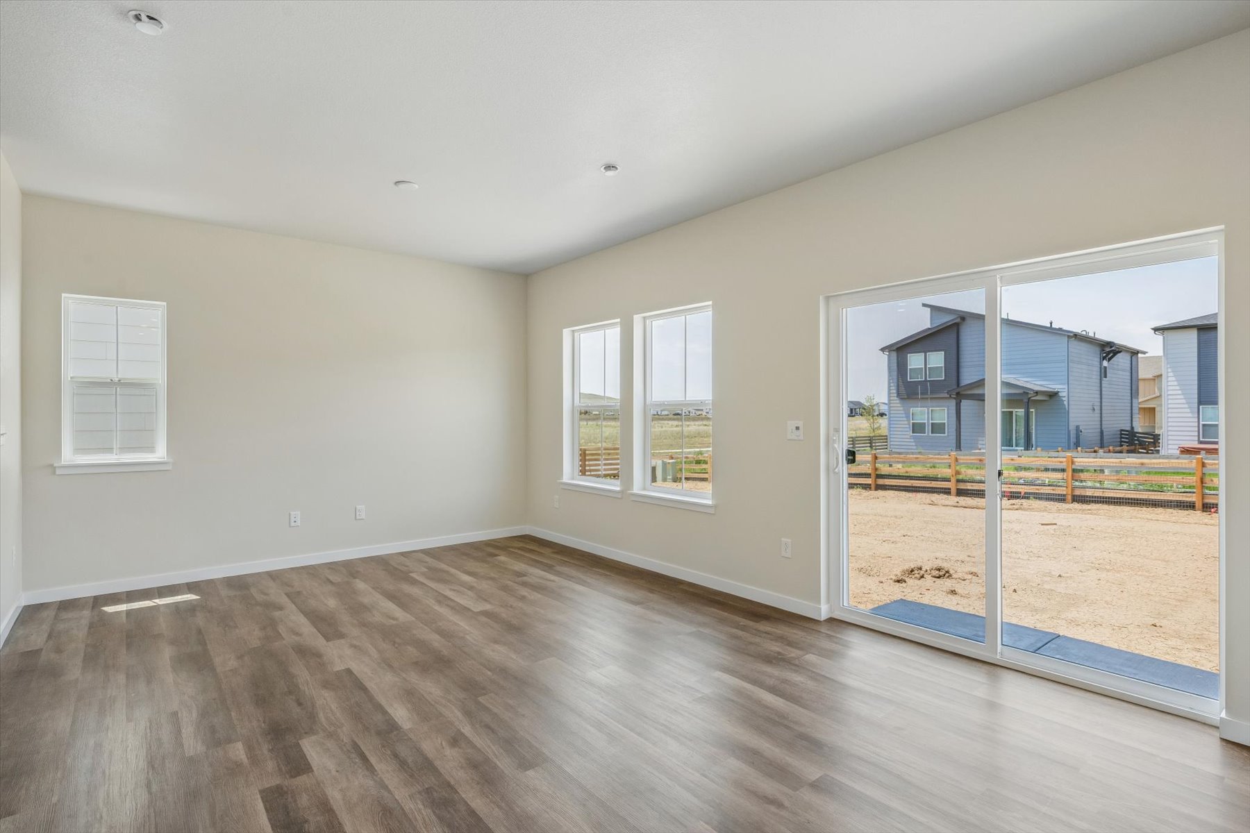 A room with a wood floor and a wood floor with a wood floor.
