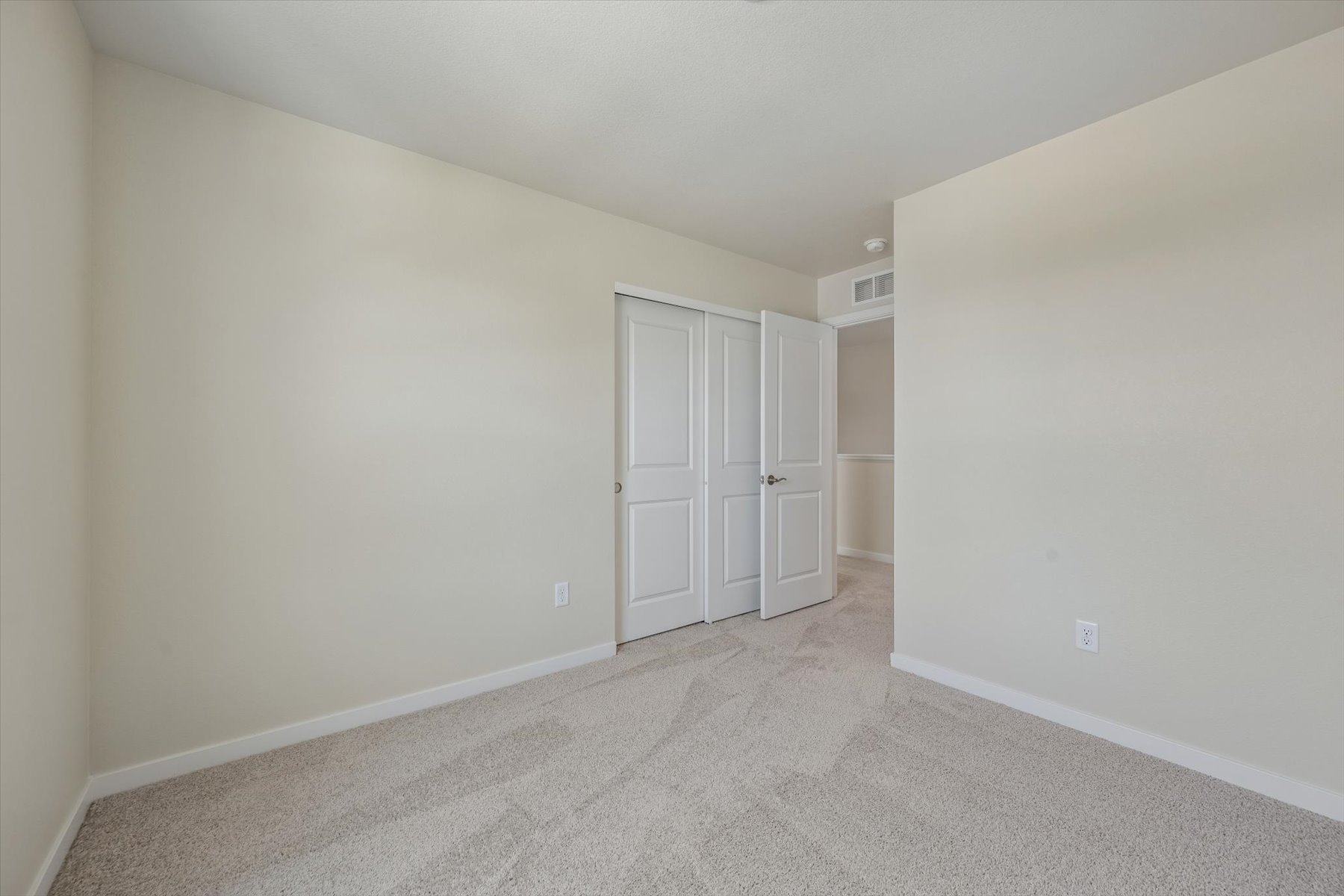 A room with white doors.