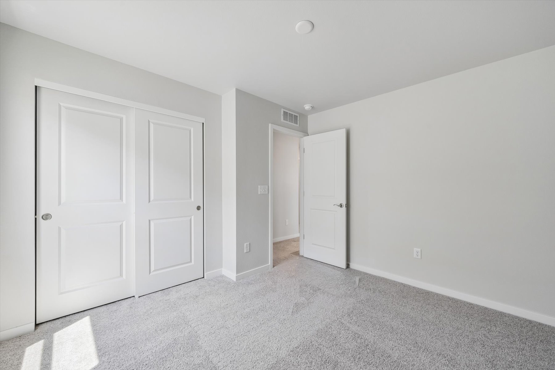 A room with white doors.