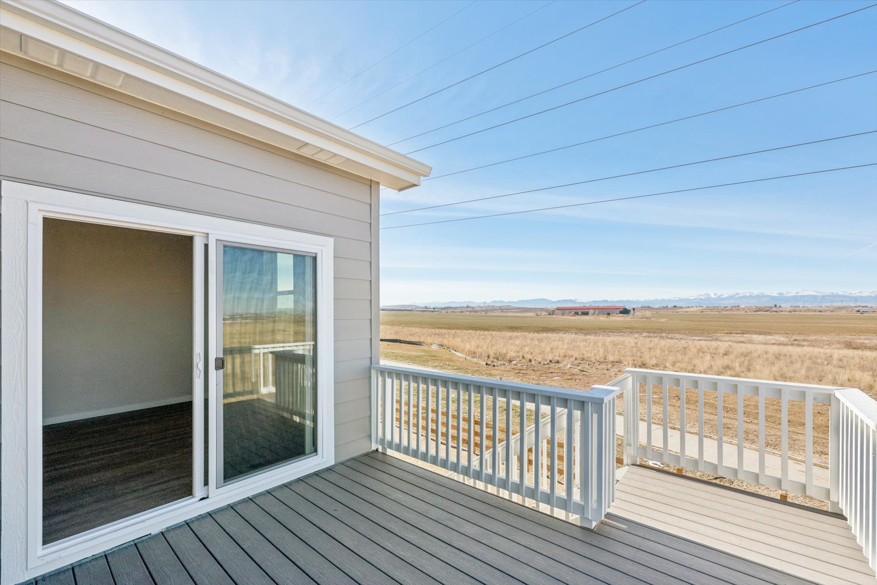 A white house with a white fence.