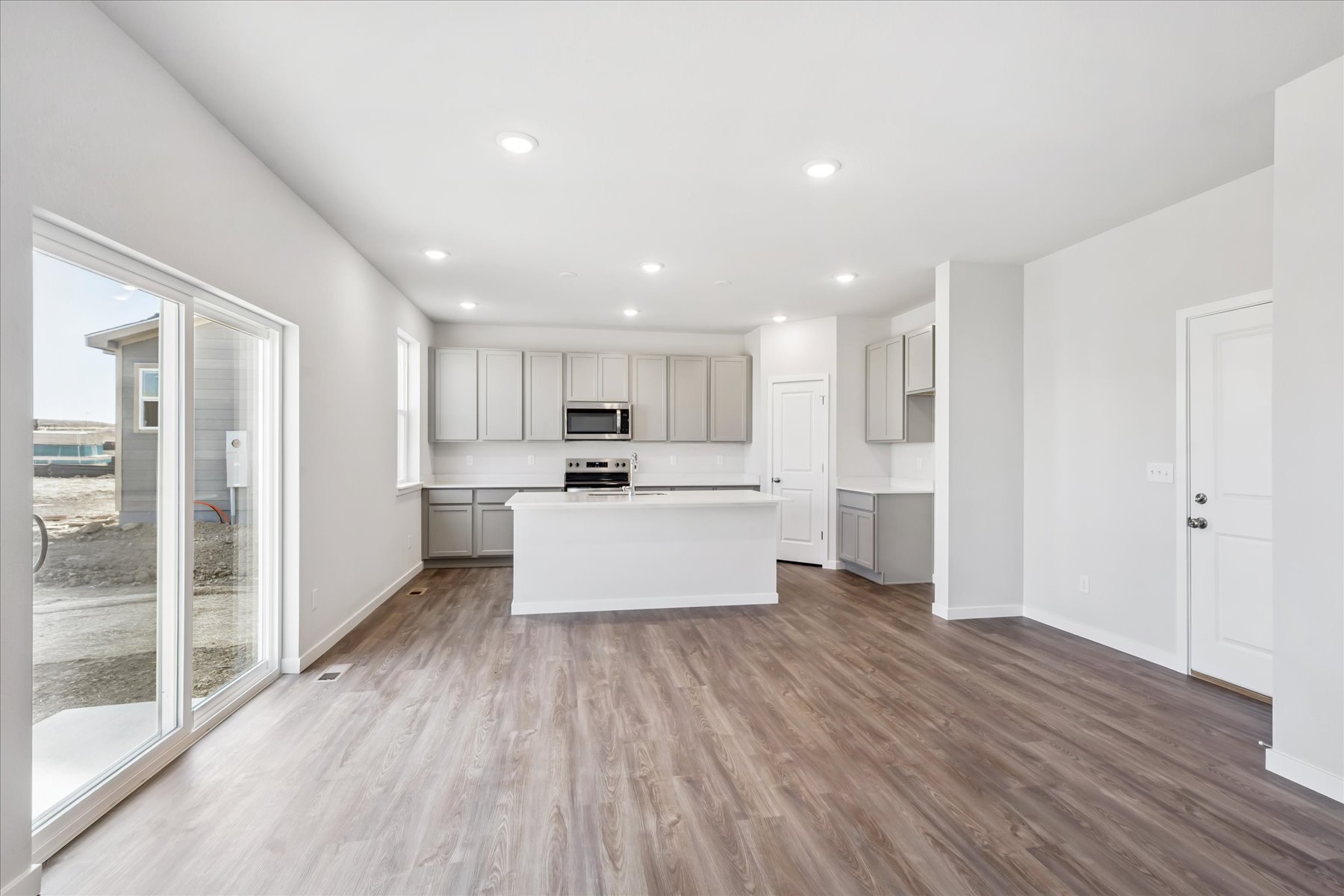 A large kitchen with white cabinets.