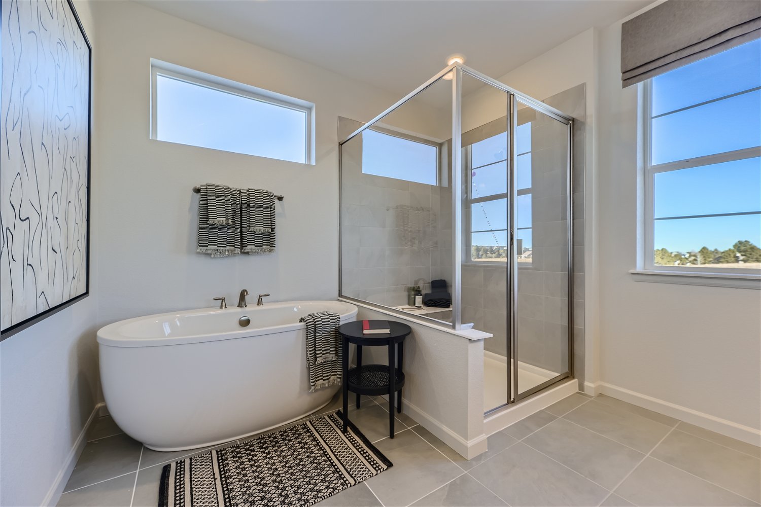 A bathroom with a tub and shower.
