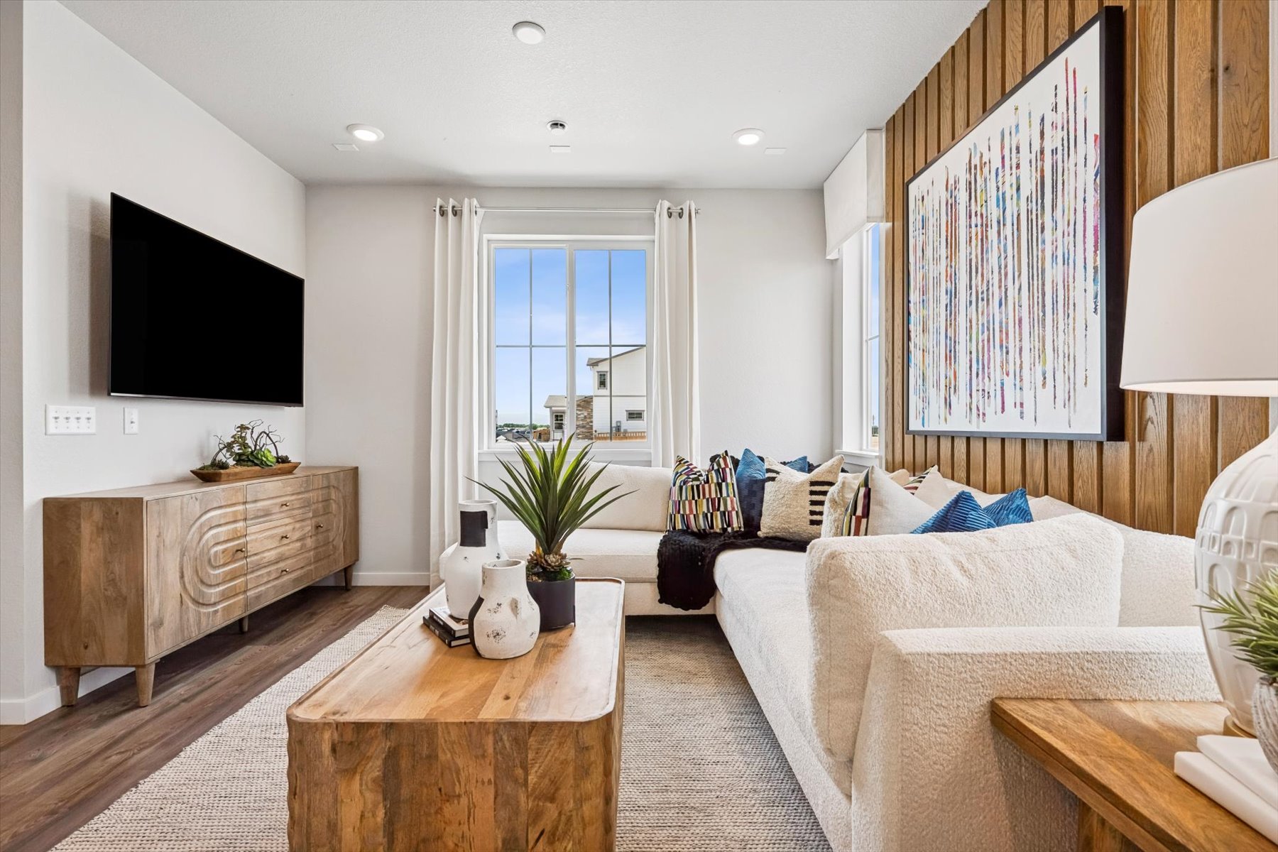 A living room with a tv and couches.