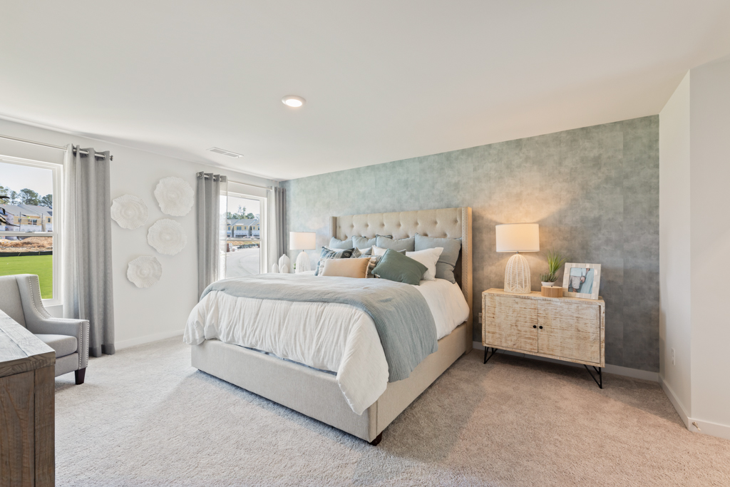 A bedroom with a large bed.