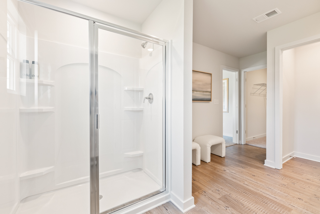 A bathroom with a glass shower.