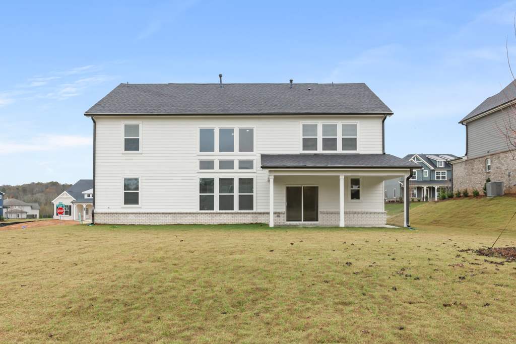 A house with a grass yard.
