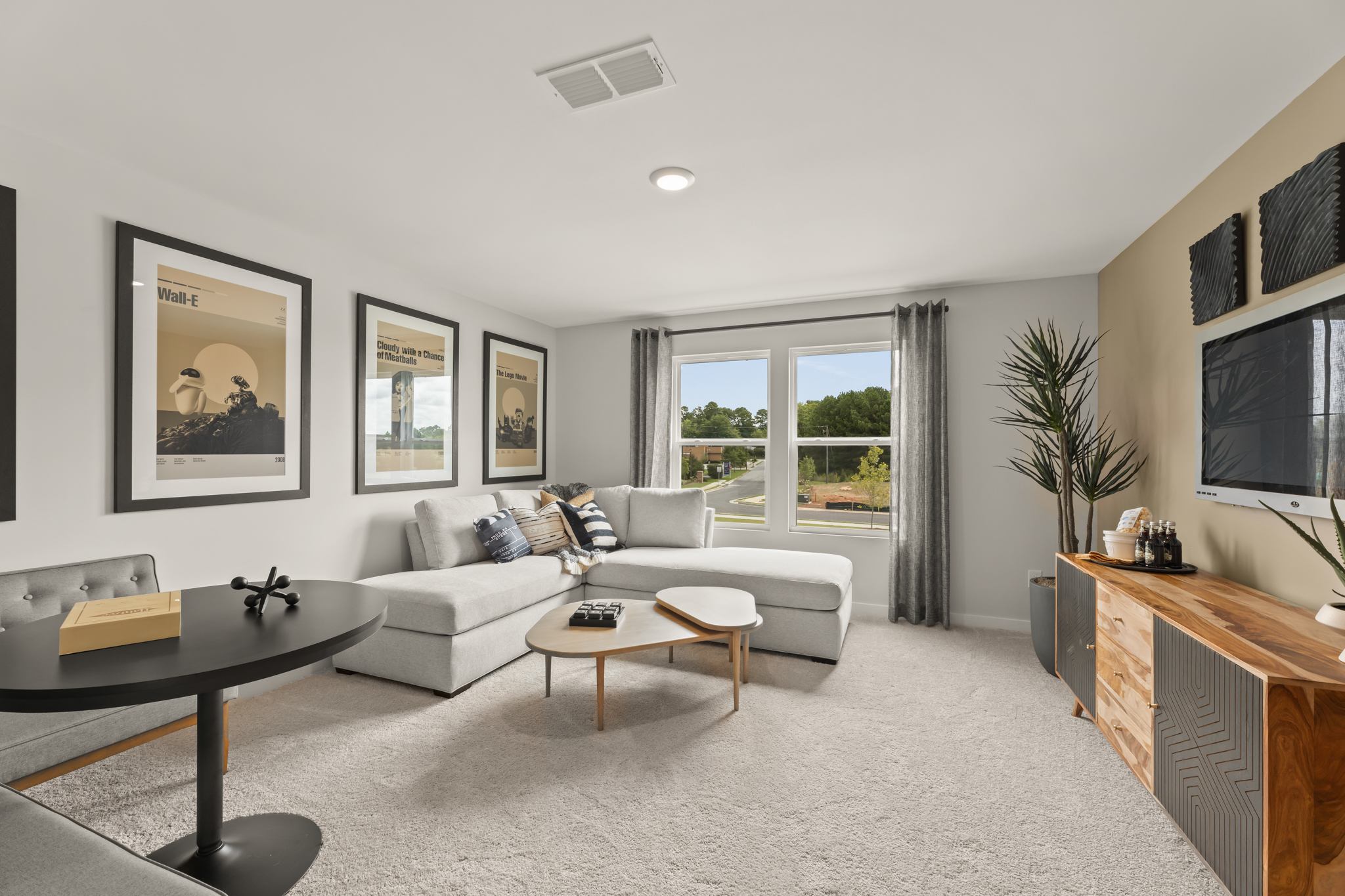 A living room with a couch and a table.