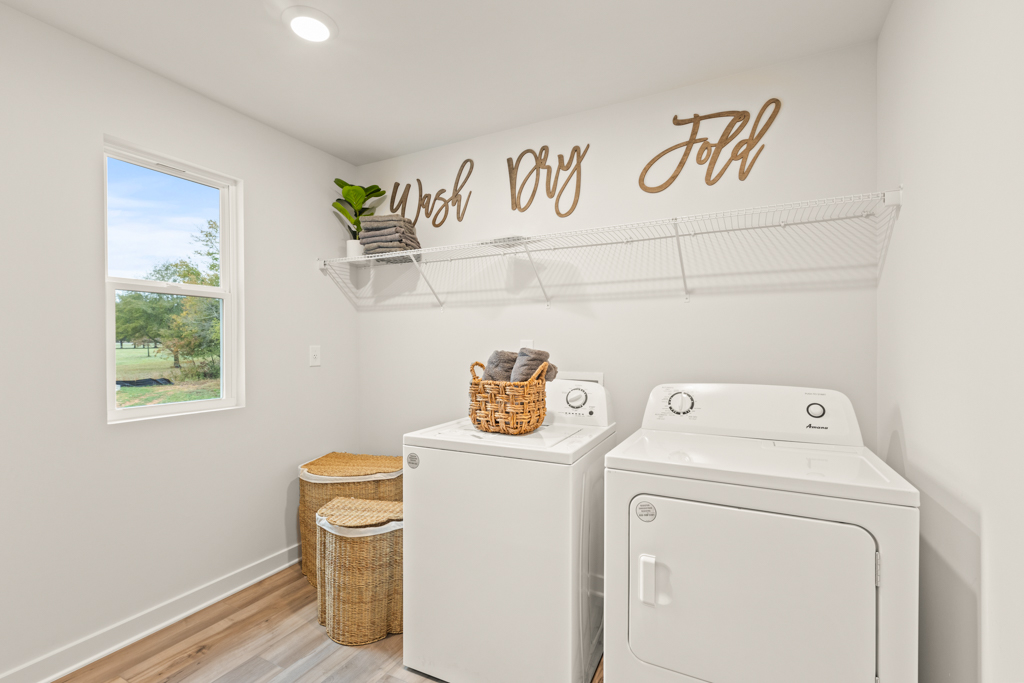 A laundry room with a laundry basket and a washing machine.