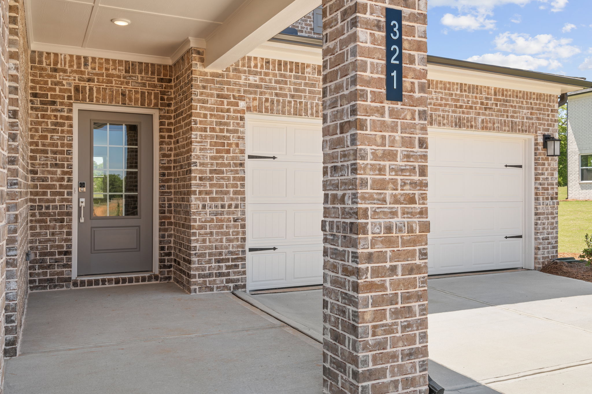 A brick building with two doors.