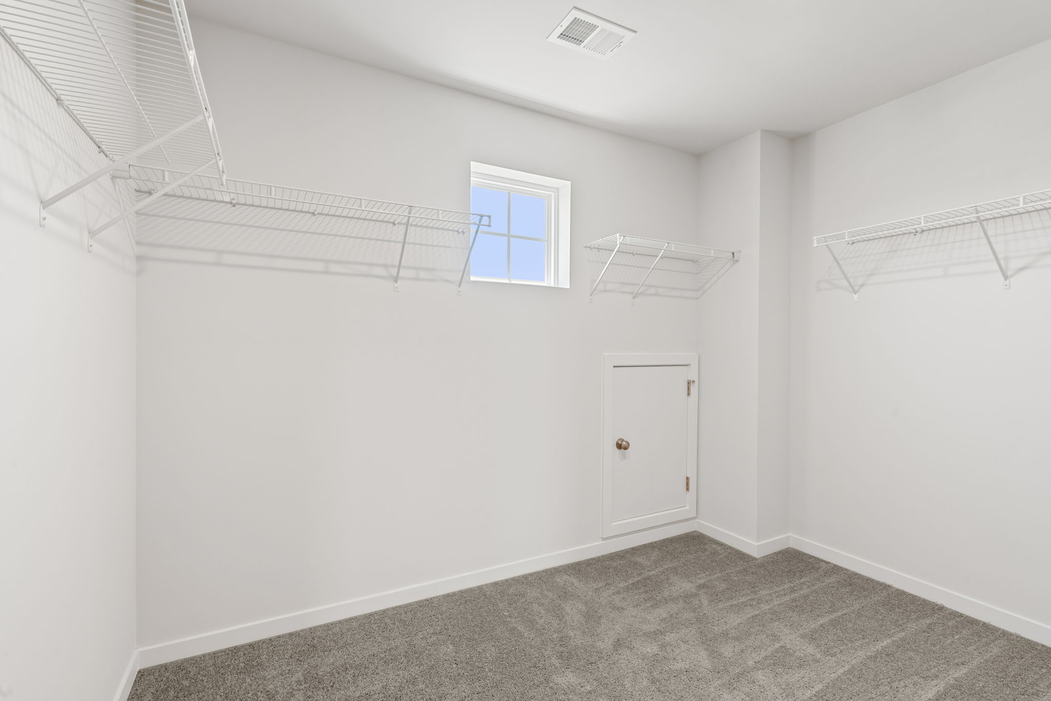 A room with a door and a window.