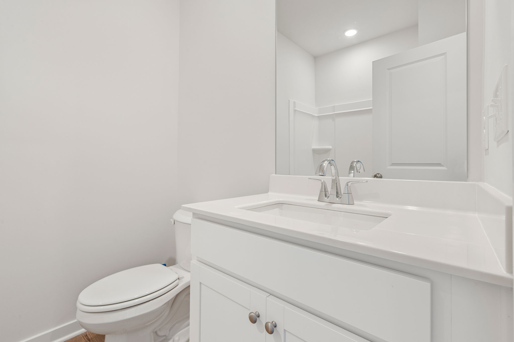 A bathroom with a sink toilet and a bathtub.