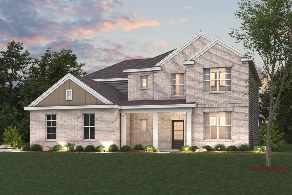A large house with a lawn in front of it.