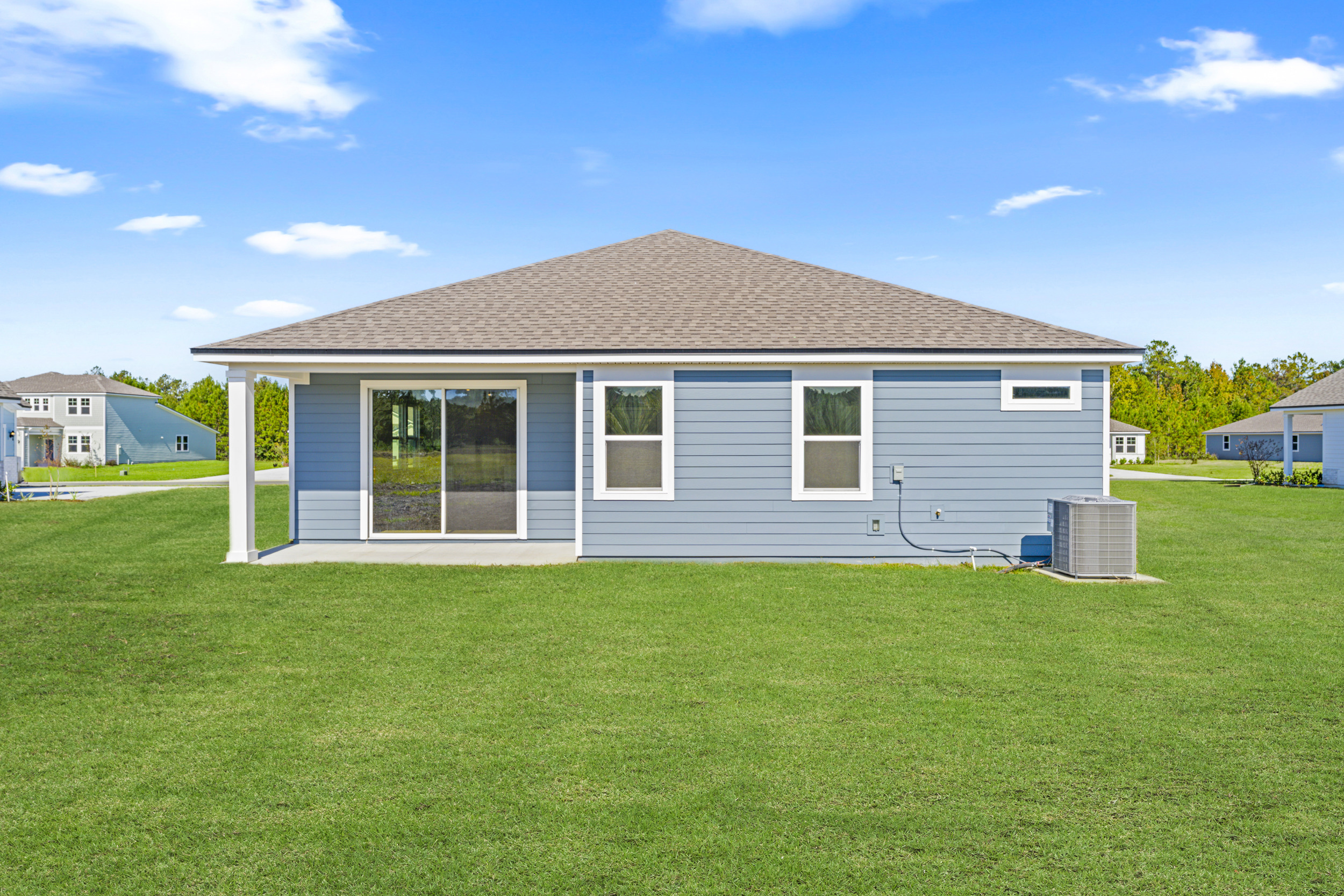 A house with a grass yard.