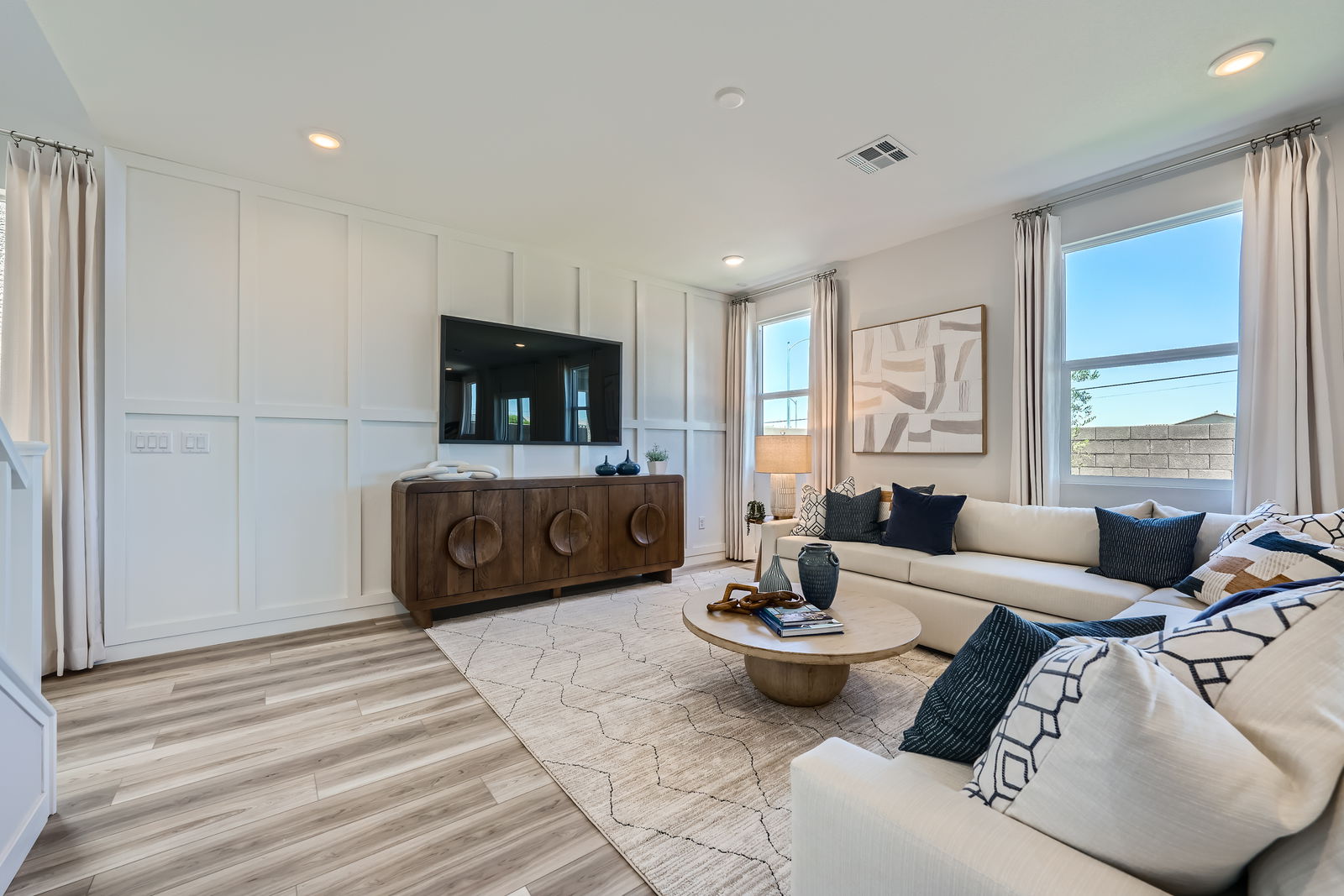 A living room with a large window.