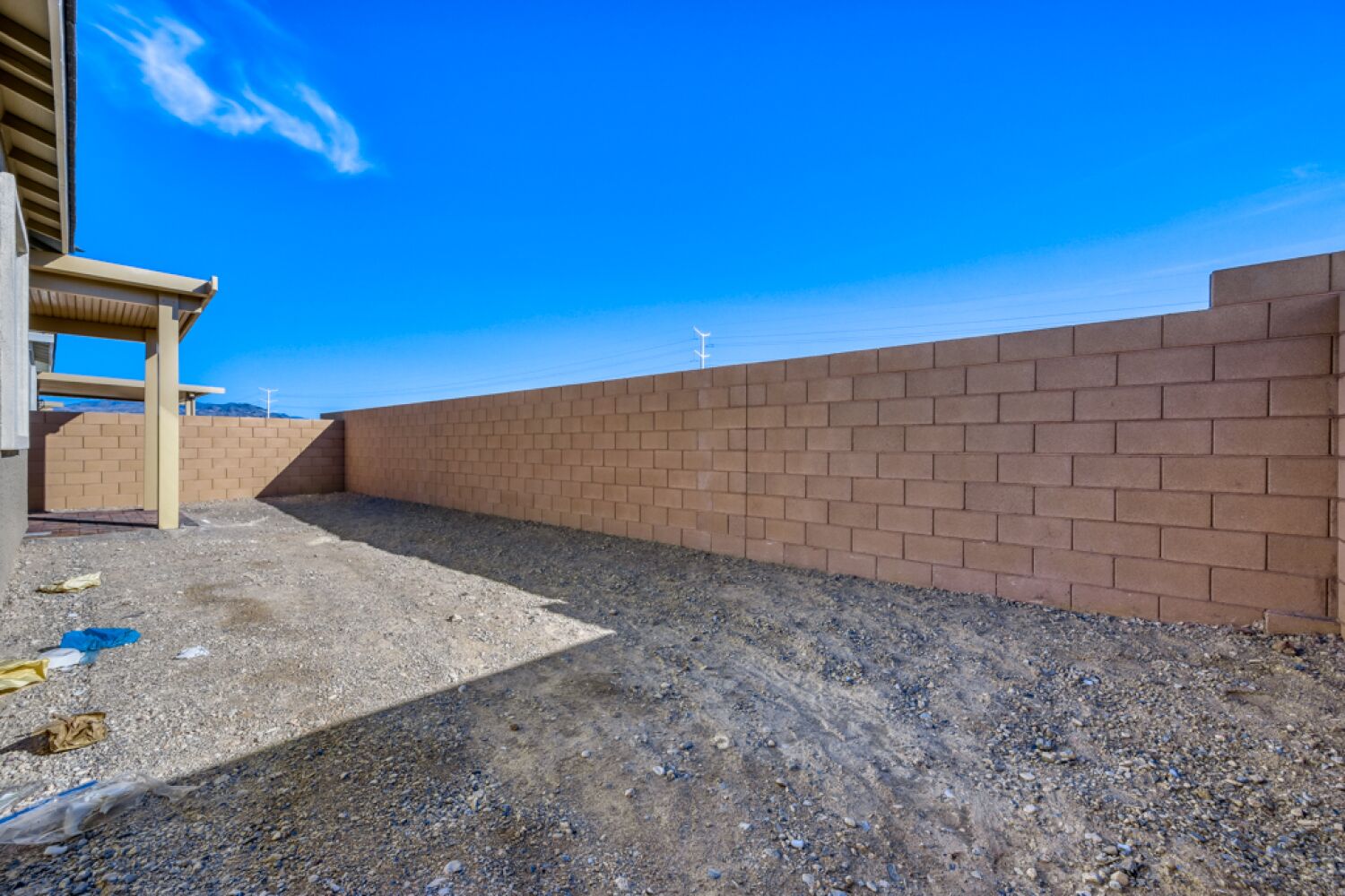 A brick wall with a blue sky.