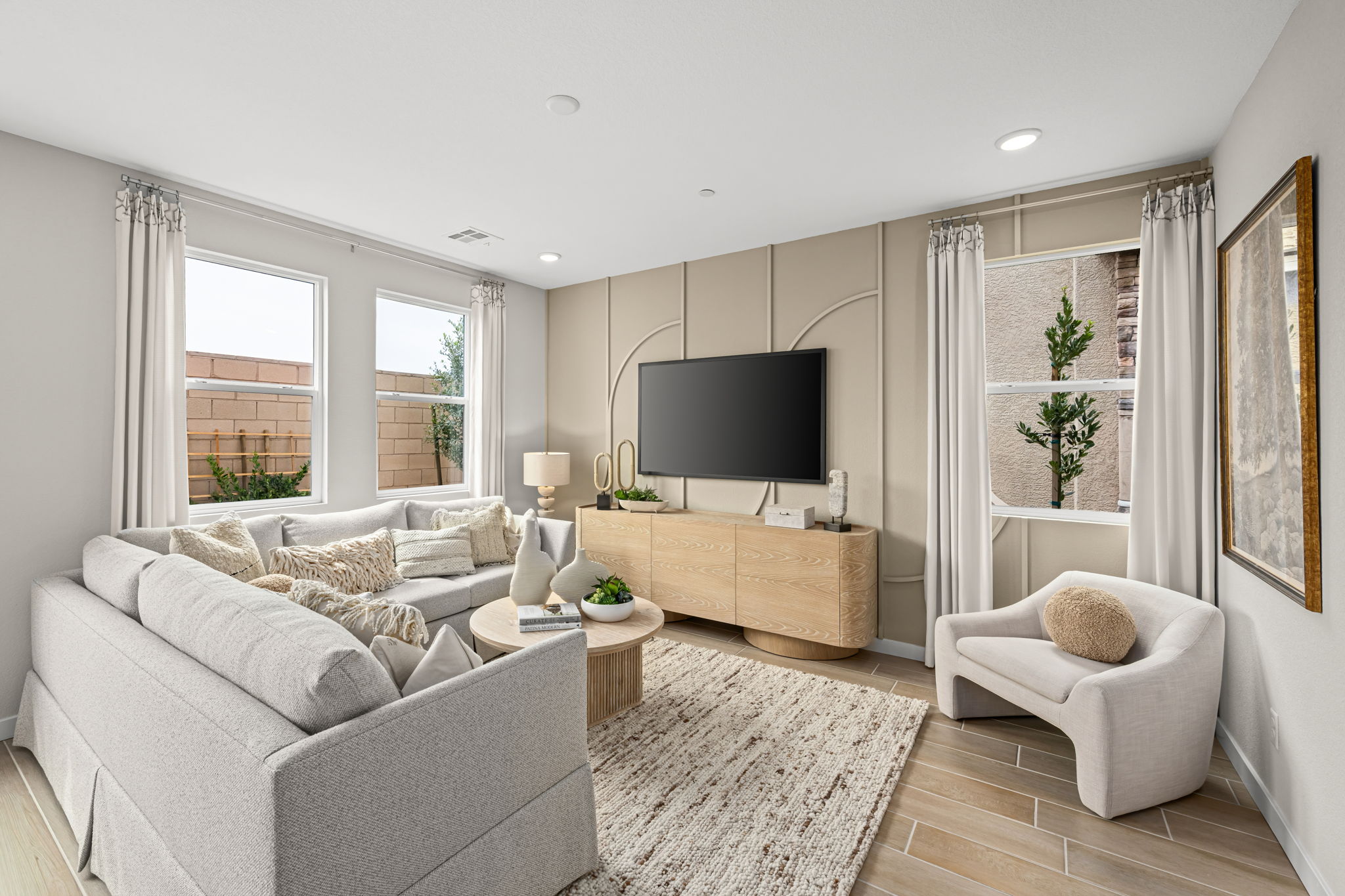 A living room with a tv and couches.