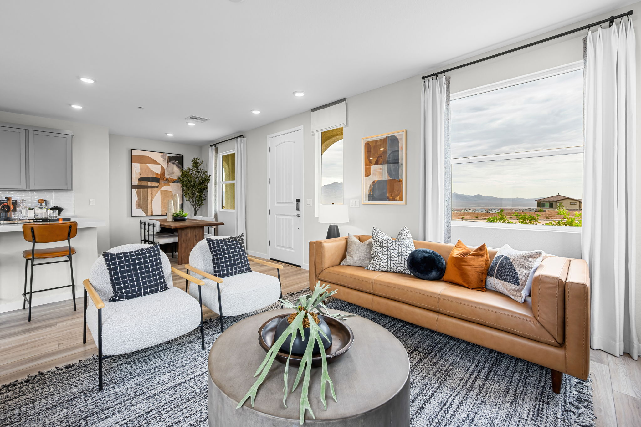 A living room with a couch and chairs.