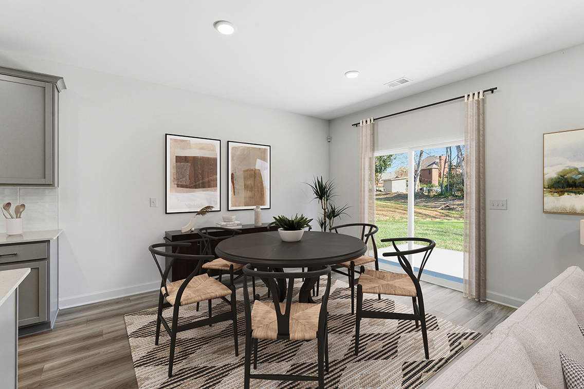 A room with a table and chairs.