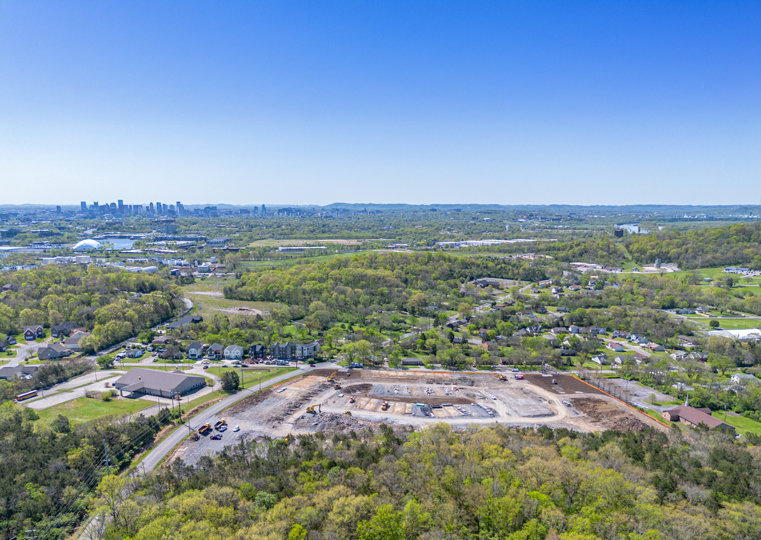 A landscape with trees and buildings.