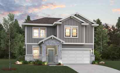 A house with a driveway and trees.