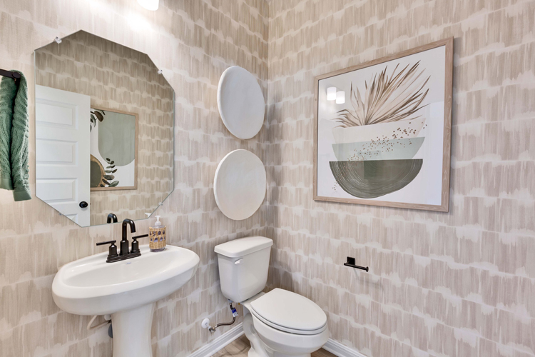 A bathroom with a toilet and sink.