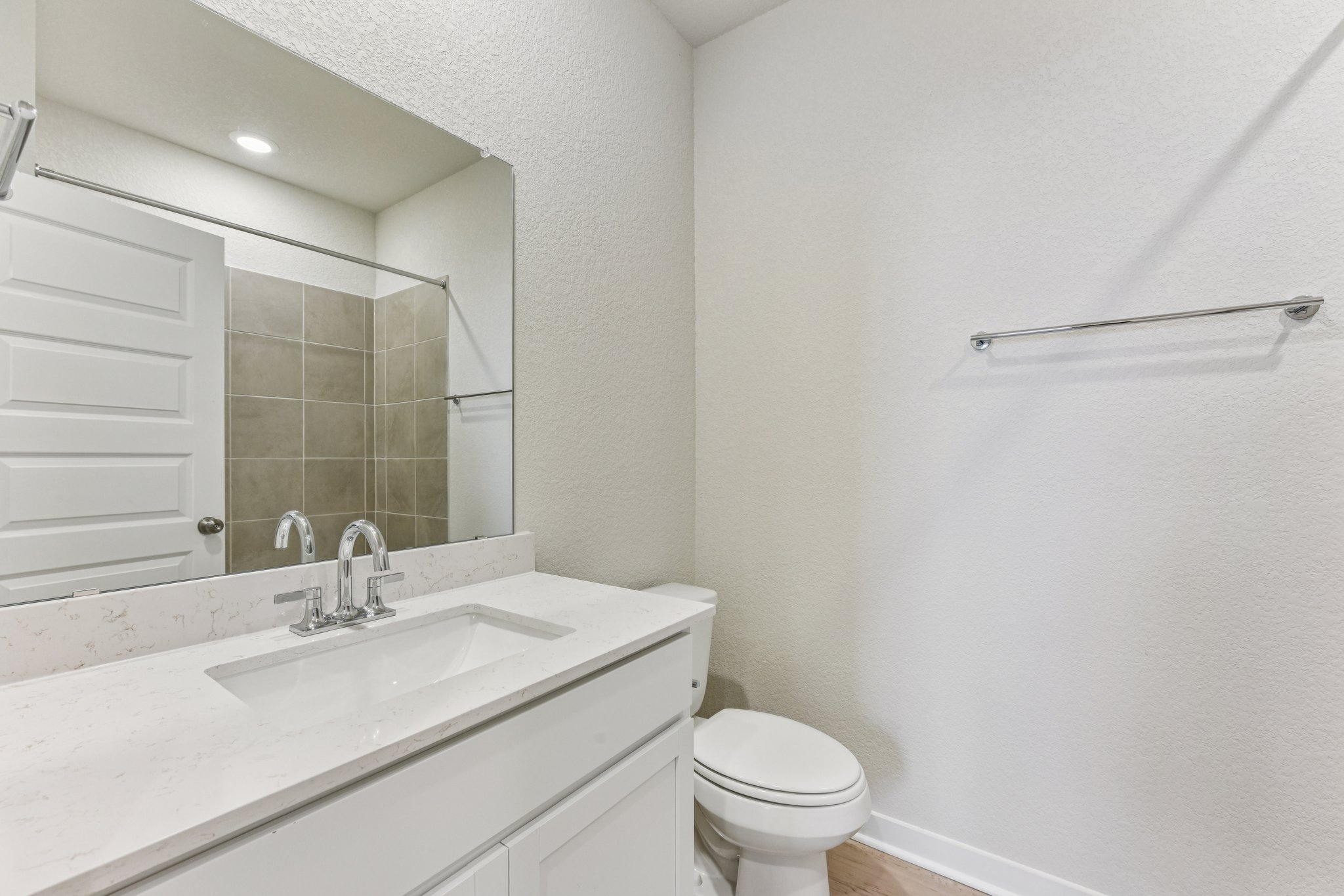 A bathroom with a sink and toilet.