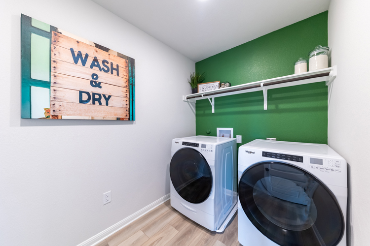 A laundry room with a washer and dryer.