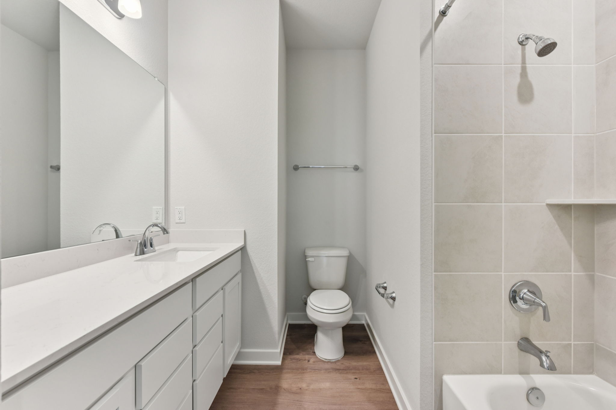A bathroom with a toilet and sink.