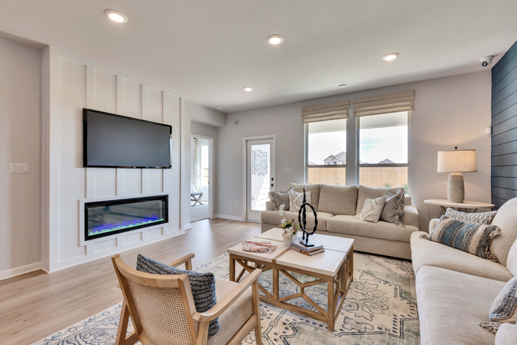 A living room with a tv and couches.