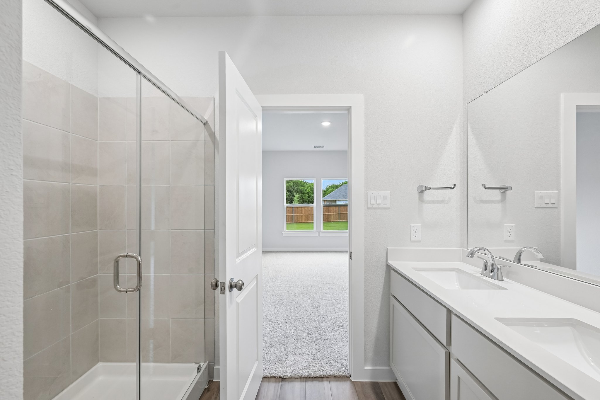 A bathroom with a glass shower.