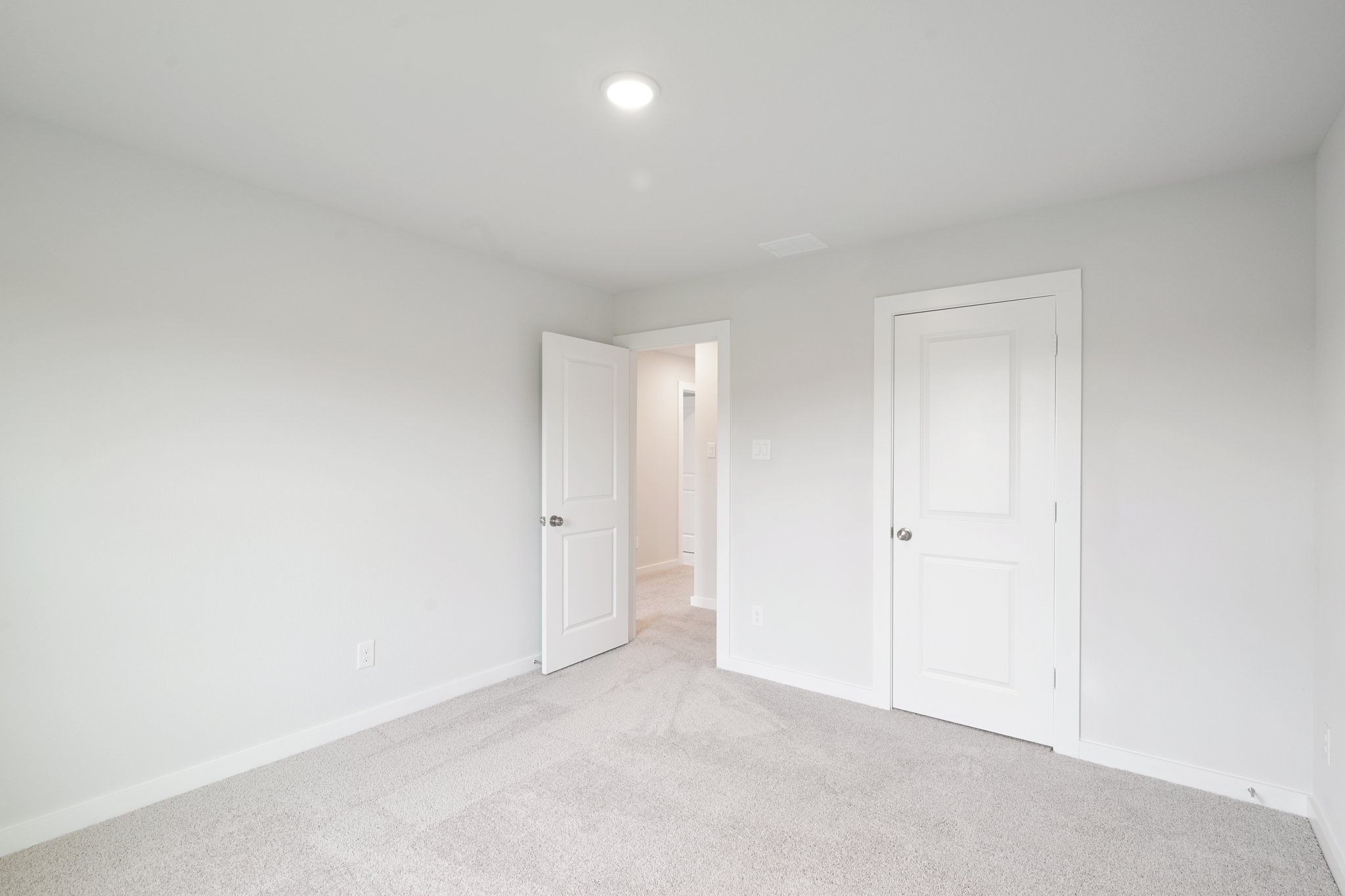 A room with white doors.