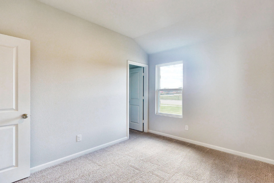 A room with a door and a window.