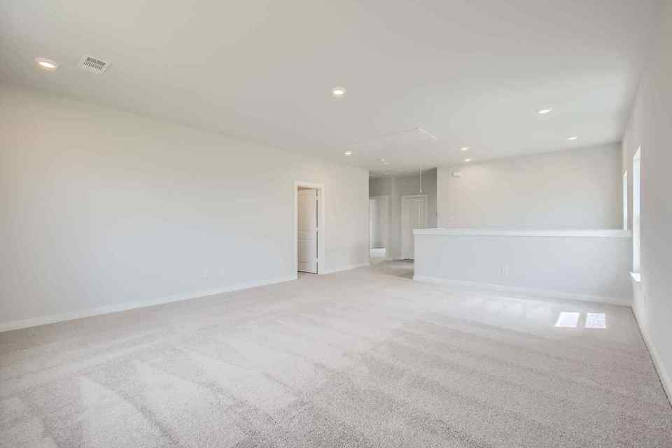 A long hallway with white walls.