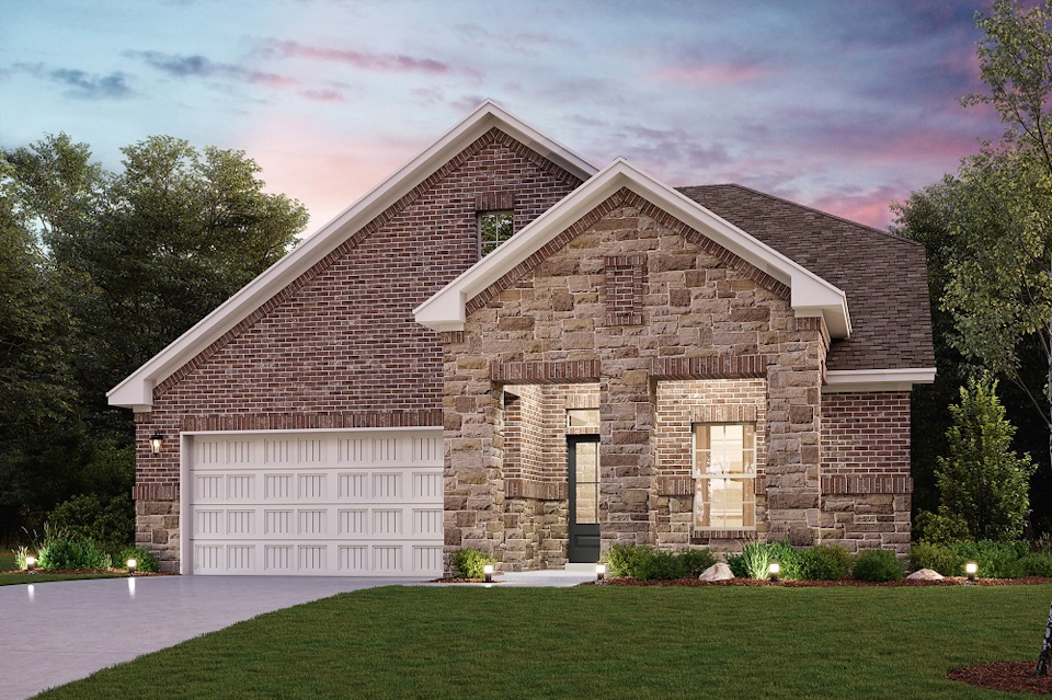 A brick house with a garage.