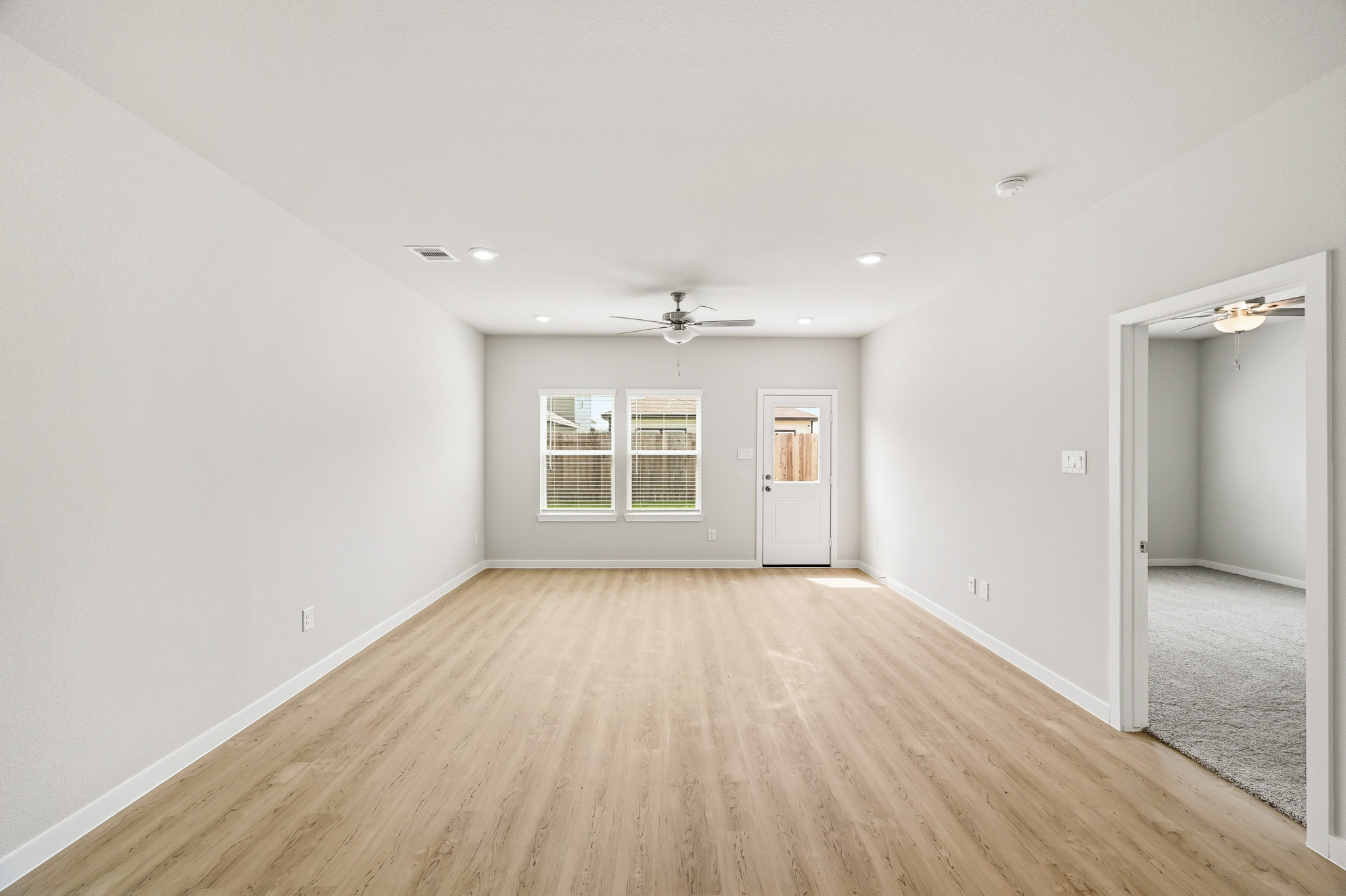 A room with a wood floor and a wood floor.