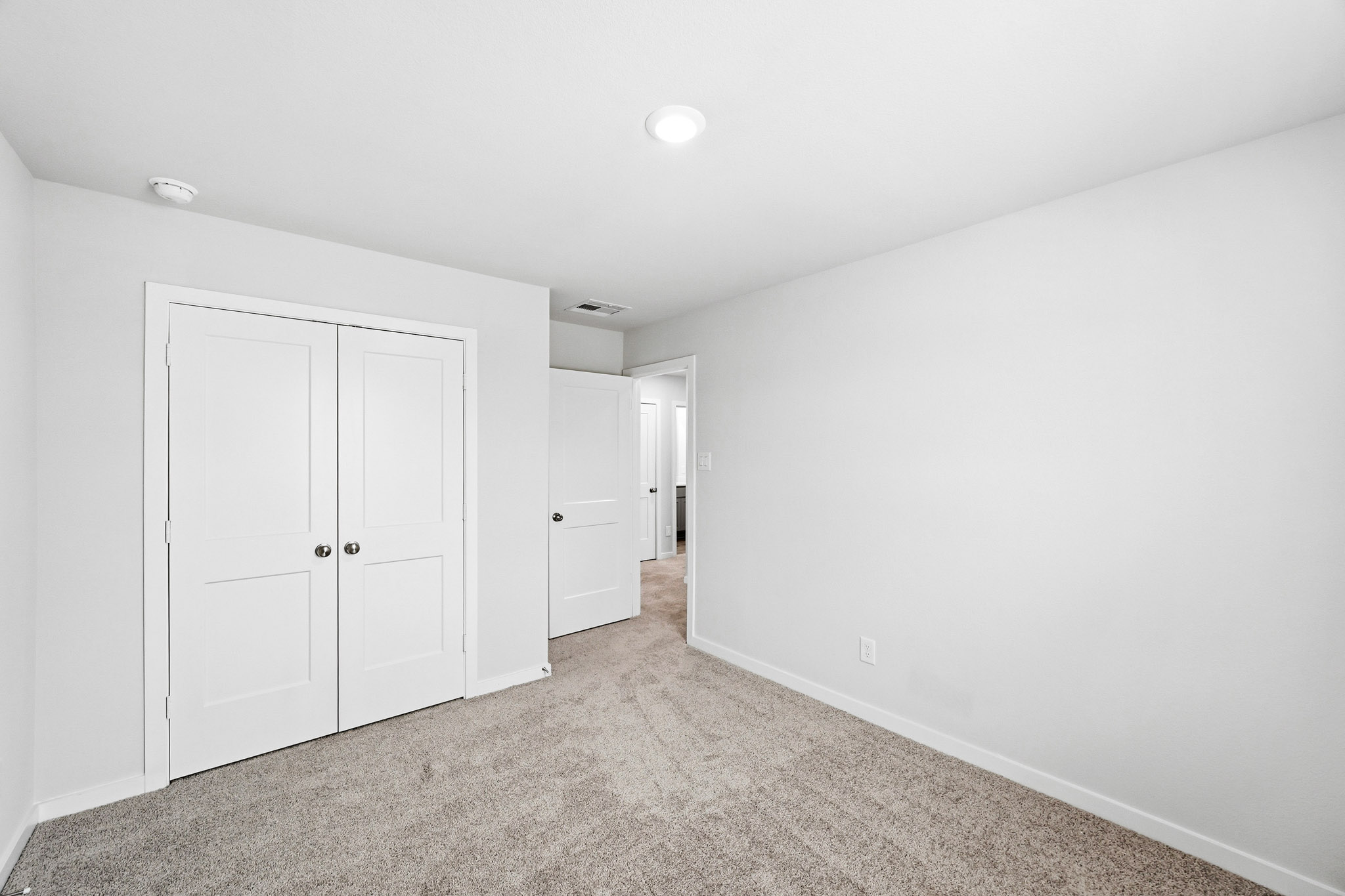 A room with white doors.
